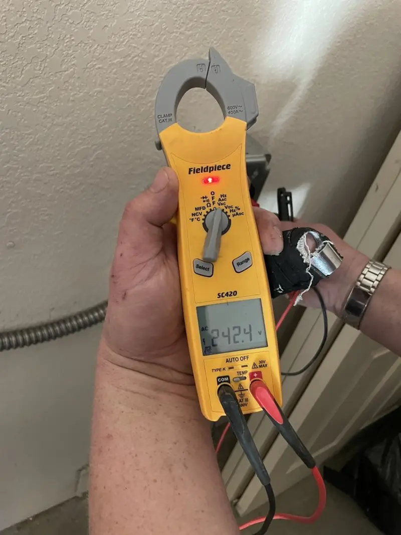 Voltage testing with clamp meter during Ceiling Fan Installation in North Brookfield